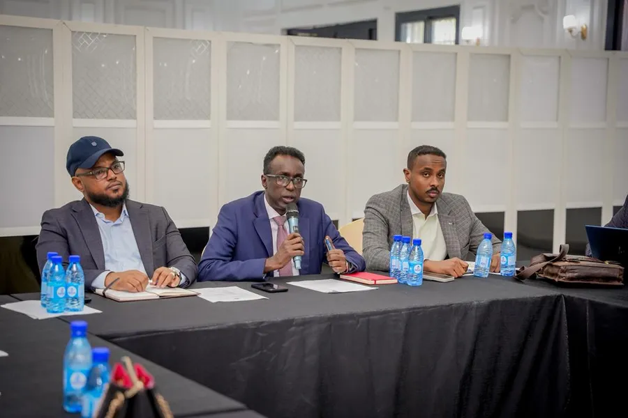 Somali ministry staff discussing policy and procedures at a Mogadishu validation workshop