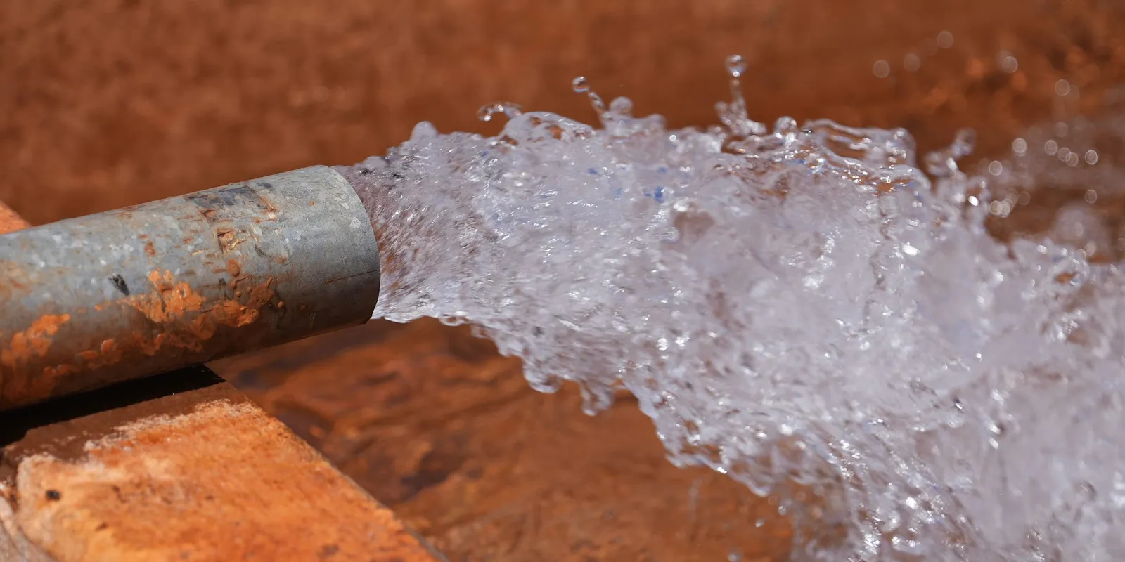 Water discharging from a borehole installation in Somalia