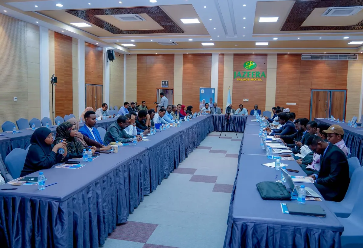 Participants seated around a large U-shaped table at an institutional workshop in Somalia
